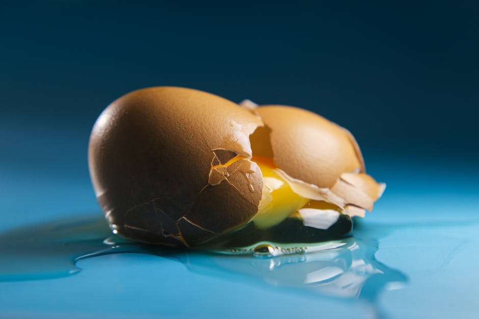 Image representing the symbolism of eggs in dreams, showcasing a pristine egg, a cracked egg, and a golden egg side by side.